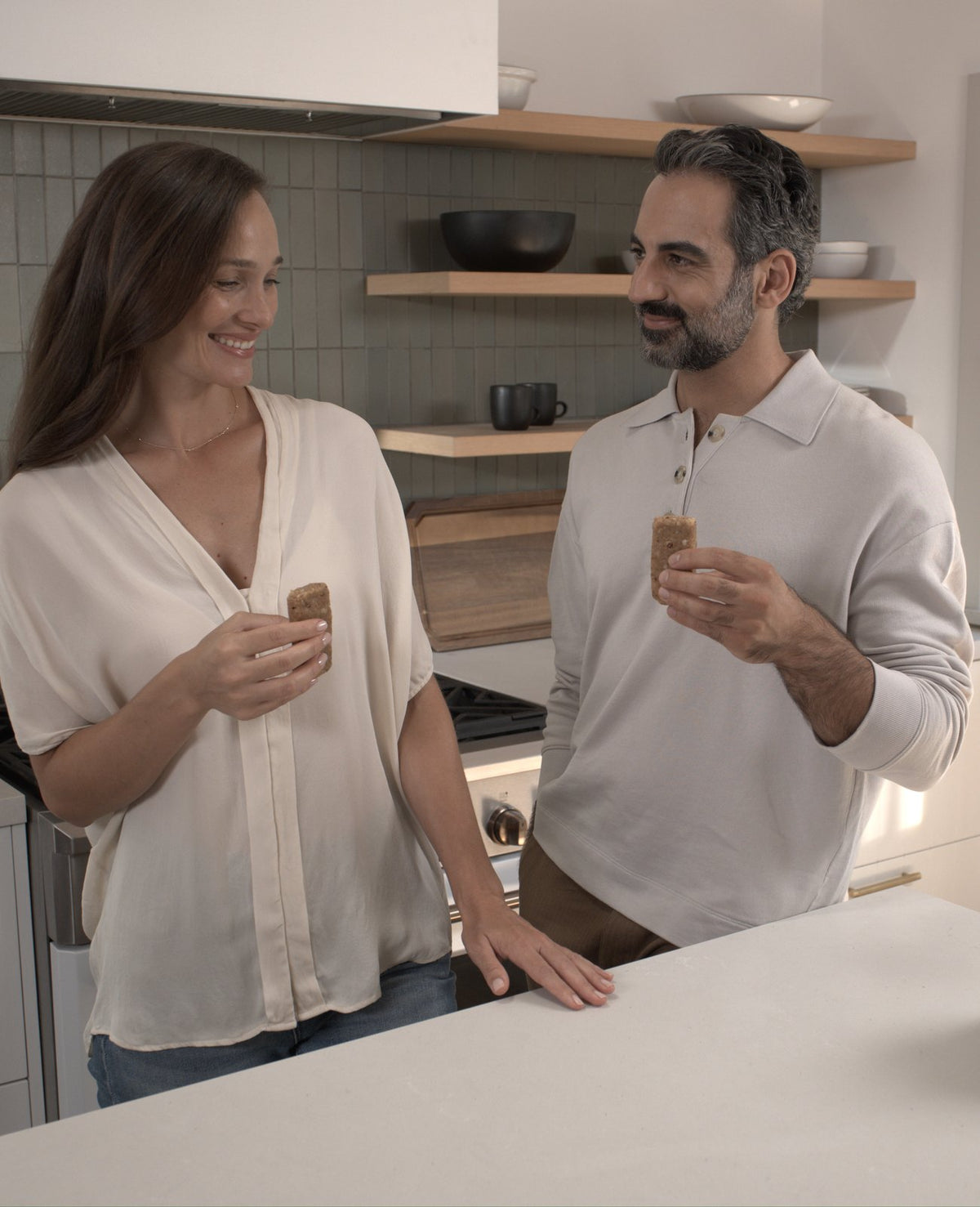 Couple enjoying Fasting Bars in the kitchen