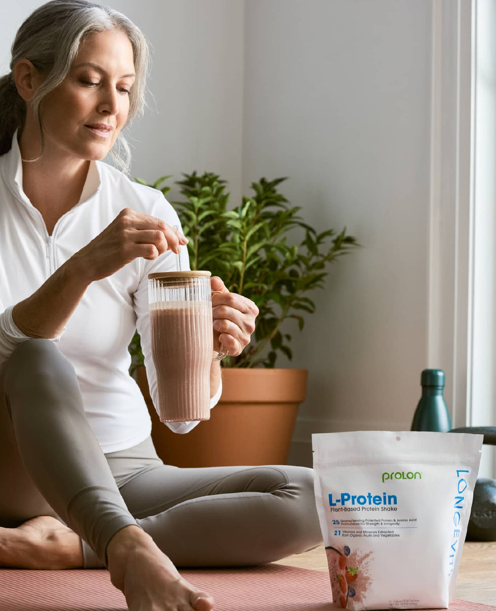 Woman preparing an L-Protein shake at home